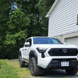 Load image into Gallery viewer, Rally Armor 24-25 Toyota Tacoma Gen 4 Black UR Mud Flap w/White Logo - Installation View