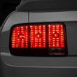 Load image into Gallery viewer, Raxiom 05-09 Ford Mustang Tail Lights- Black Housing (Smoked Lens) - Main Product View