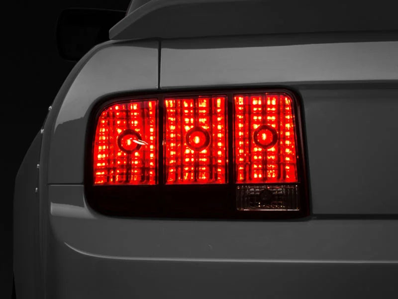 Raxiom 05-09 Ford Mustang Tail Lights- Black Housing (Smoked Lens) - Main Product View