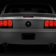 Load image into Gallery viewer, Raxiom 05-09 Ford Mustang Tail Lights- Black Housing (Smoked Lens) - Side View