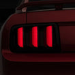 Load image into Gallery viewer, Raxiom 05-09 Ford Mustang Vector V2 LED Tail Lights- Black Housing (Smoked Lens) - Main Product View