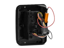 Load image into Gallery viewer, Raxiom 07-18 Jeep Wrangler JK LED Tail Lights- Black Housing (Smoked Lens) - Side View