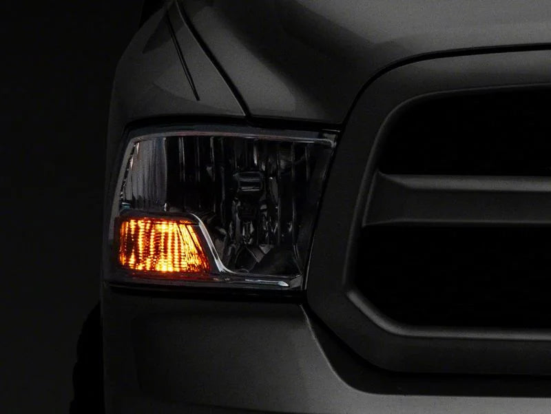 Raxiom 09-18 Dodge RAM 1500 Axial OEM Rep Headlights w/ Single Bulb- Chrome Housing (Clear Lens) - Side View