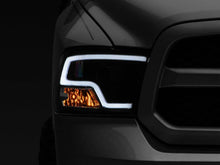 Load image into Gallery viewer, Raxiom 09-18 RAM 1500 LED Halo Projector Headlights- Black Housing (Clear Lens) - Additional View 9
