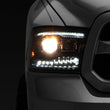 Load image into Gallery viewer, Raxiom 09-18 RAM 1500 LED Projector Headlights w/ Switchback Turn Signals- Blk Housing (Clear Lens) - Main Product View