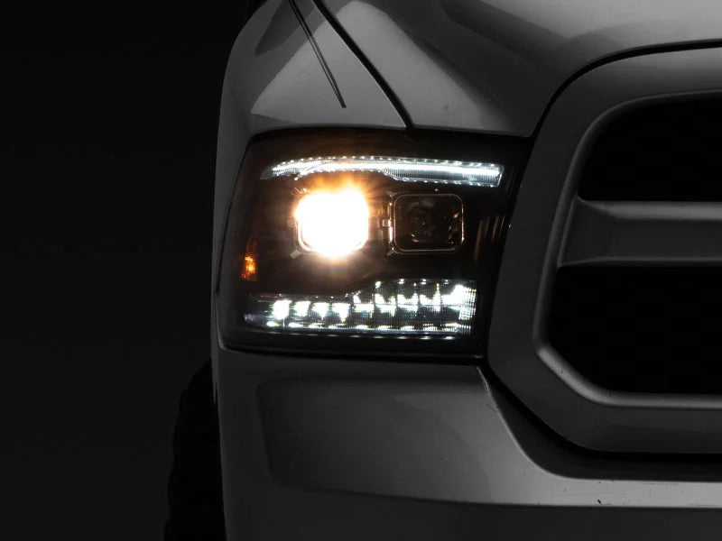 Raxiom 09-18 RAM 1500 LED Projector Headlights w/ Switchback Turn Signals- Blk Housing (Clear Lens) - Main Product View