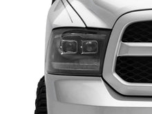 Load image into Gallery viewer, Raxiom 09-18 RAM 1500 LED Projector Headlights w/ Switchback Turn Signals- Blk Housing (Clear Lens) - Additional View 8