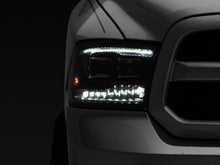 Load image into Gallery viewer, Raxiom 09-18 RAM 1500 LED Projector Headlights w/ Switchback Turn Signals- Blk Housing (Clear Lens) - Additional View 11