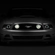 Load image into Gallery viewer, Raxiom 13-14 Ford Mustang GT CCFL Halo Fog Lights (Smoked) - Side View