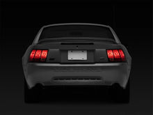 Load image into Gallery viewer, Raxiom 96-04 Ford Mustang Excluding 99-01 Cobra Sequential Tail Light Kit (Plug-and-Play Harness) - Installation View