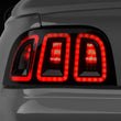 Load image into Gallery viewer, Raxiom 96-98 Ford Mustang Icon LED Tail Lights- Black Housing (Smoked Lens) - Main Product View