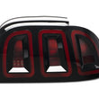 Load image into Gallery viewer, Raxiom 96-98 Ford Mustang Icon LED Tail Lights- Black Housing (Smoked Lens) - Side View