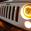Load image into Gallery viewer, Raxiom 97-18 Jeep Wrangler TJ/JK Axial Halo Headlights w/ DRL Amber Signals- Blk Hsng (Clear Lens) - Installation View