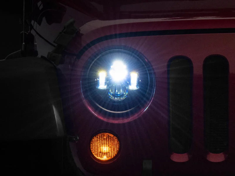 Raxiom 97-18 Jeep Wrangler TJ/JK Axial Series LED Daymaker Headlights- Black Housing (Clear Lens) - Main Product View