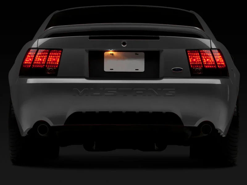 Raxiom 99-04 Ford Mustang Excluding 99-01 Cobra Tail Lights- Black Housing (Smoked Lens) - Back View