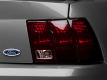 Load image into Gallery viewer, Raxiom 99-04 Ford Mustang Excluding 99-01 Cobra Tail Lights- Black Housing (Smoked Lens) - Installation View