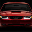 Load image into Gallery viewer, Raxiom Axial Series Headlights w/ LED Bar - Black Housing (Clear Lens) fits 1999-2004 Ford Mustang - Additional View 5