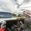 Load image into Gallery viewer, Roll-N-Lock 07-13 Chevy Silverado/Sierra w/ OE Rail Caps LB 96-1/4in Cargo Manager - Side View