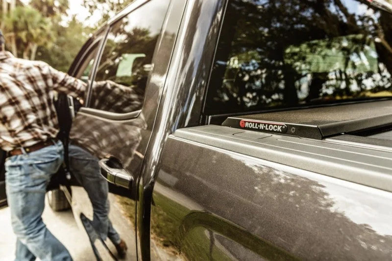 Roll-N-Lock 09-14 Ford F-150 XSB 67in A-Series Retractable Tonneau Cover - Side View