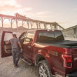 Load image into Gallery viewer, Roll-N-Lock 09-14 Ford F-150 XSB 67in A-Series Retractable Tonneau Cover - Installation View