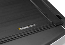 Load image into Gallery viewer, Roll-N-Lock 2019 Ram 1500 XSB 65.5in A-Series Retractable Tonneau Cover - Installation View