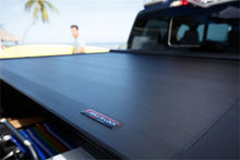 Load image into Gallery viewer, Roll-N-Lock 2020 Chevy Silverado / GMC Sierra 2500-3500 77-3/8in E-Series Retractable Tonneau Cover - Main Product View