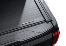 Load image into Gallery viewer, Roll-N-Lock 2022+ Toyota Tundra Ext Cab (78.7in.) A-Series XT Cover - Installation View
