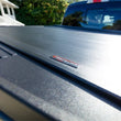 Load image into Gallery viewer, Roll-N-Lock 5ft 7in Bed Ret retractable Tonneau Cover fits 2022-2026 Toyota Tundra - Installation View