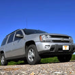 Load image into Gallery viewer, Rough Country 2 Inch Lift Kit | Chevy/GMC Envoy/Trailblazer 2WD/4WD (2002-2009) 289 - Installation View