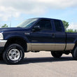 Load image into Gallery viewer, Rough Country 2.5 Inch Leveling Kit | Leaf Spring  | M1 | Ford F-250/F-350 Super Duty (99-04) 48940 - Installation View
