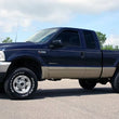 Load image into Gallery viewer, Rough Country 2.5 Inch Leveling Kit | Leaf Spring  | V2 | Ford F-250/F-350 Super Duty (99-04) 48970 - Installation View