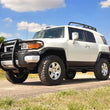 Load image into Gallery viewer, Rough Country 3 Inch Lift Kit | Red Spacers | Toyota 4Runner (03-09)/FJ Cruiser (07-14) 76530RED - Installation View