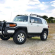 Load image into Gallery viewer, Rough Country 3 Inch Lift Kit | Red Spacers | Toyota 4Runner (03-09)/FJ Cruiser (07-14) 76530RED - Installation View