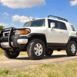 Load image into Gallery viewer, Rough Country 3 Inch Lift Kit | Red Spacers | Toyota 4Runner (03-09)/FJ Cruiser (07-14) 76530RED - Installation View