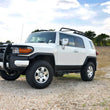 Load image into Gallery viewer, Rough Country 3 Inch Lift Kit | Red Spacers | Toyota 4Runner (03-09)/FJ Cruiser (07-14) 76530RED - Installation View