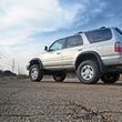 Load image into Gallery viewer, Rough Country 3 Inch Lift Kit | Toyota 4Runner 2WD/4WD (1996-2002) 77130 - Installation View