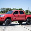 Load image into Gallery viewer, Rough Country 3.5 Inch Lift Kit | UCA | M1 Struts | Toyota Tacoma 4WD (2005-2023) 74240 - Installation View