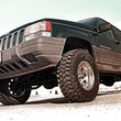 Load image into Gallery viewer, Rough Country 3.5 Inch Lift Kit | V-6 Motor | Jeep Grand Cherokee ZJ 2WD/4WD (1993-1998) 636.20 - Installation View
