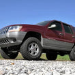 Load image into Gallery viewer, Rough Country 4 Inch Lift Kit | Jeep Grand Cherokee WJ 2WD/4WD (1999-2004) 698.20 - Installation View