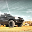 Load image into Gallery viewer, Rough Country 4 Inch Lift Kit | Long Arm | Jeep Grand Cherokee WJ 4WD (1999-2004) 90820 - Installation View