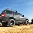 Load image into Gallery viewer, Rough Country 4 Inch Lift Kit | Long Arm | Jeep Grand Cherokee WJ 4WD (1999-2004) 90820 - Installation View