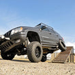 Load image into Gallery viewer, Rough Country 4 Inch Lift Kit | Long Arm | Jeep Grand Cherokee WJ 4WD (1999-2004) 90820 - Installation View