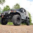 Load image into Gallery viewer, Rough Country 4 Inch Lift Kit | M1 | Jeep Wrangler TJ 4WD (1997-2002) 90640 - Installation View