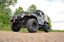Load image into Gallery viewer, Rough Country 4 Inch Lift Kit | M1 | Jeep Wrangler TJ 4WD (1997-2002) 90640 - Installation View