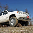 Load image into Gallery viewer, Rough Country 4 Inch Lift Kit | X-Series | Jeep Grand Cherokee WJ 2WD/4WD (1999-2004) 639P - Installation View