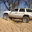 Load image into Gallery viewer, Rough Country 4 Inch Lift Kit | X-Series | Jeep Grand Cherokee WJ 2WD/4WD (1999-2004) 639P - Installation View