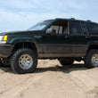 Load image into Gallery viewer, Rough Country 4 Inch Lift Kit | X-Series | Jeep Grand Cherokee ZJ 2WD/4WD (1993-1998) 68820 - Installation View