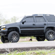 Load image into Gallery viewer, Rough Country 6 Inch Lift Kit | NTD | M1 | Chevy/GMC Tahoe/Yukon 2WD/4WD (2000-2006) 28040 - Installation View