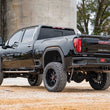 Load image into Gallery viewer, Rough Country 7 Inch Lift Kit | NTD | M1 | w/ Overloads | Chevy/GMC 2500HD/3500HD (20-26) - Back View