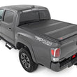 Load image into Gallery viewer, Rough Country Hard Low Profile Bed Cover | 6' Bed | Toyota Tacoma 2WD/4WD (2016-2023) - Back View